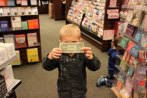 He found a dollar bill on one of the bookshelves!